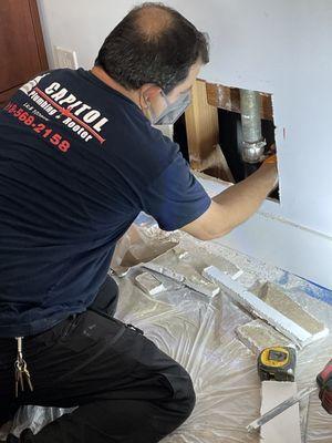 VJ had to cut a hole in our drywall to access pipes and install a clean out.