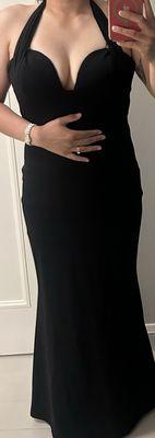 Hemmed a few inches off the bottom and brought halter up an inch and a half. Clean stitching.