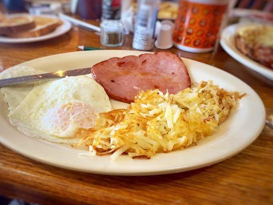 Basic two eggs with hash browns and ham. Good chunk of ham.