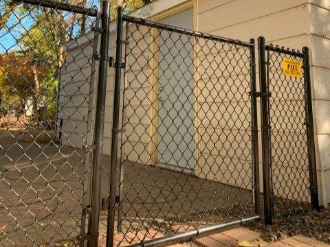 Black Chain Link Fence is a durable, cost-effective option with galvanized steel and a black vinyl coating for extra protection.
