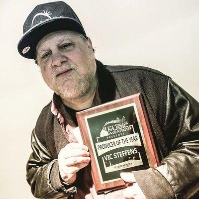 Owner Vic Steffens holding New England Music Awards Producer of the Year award.