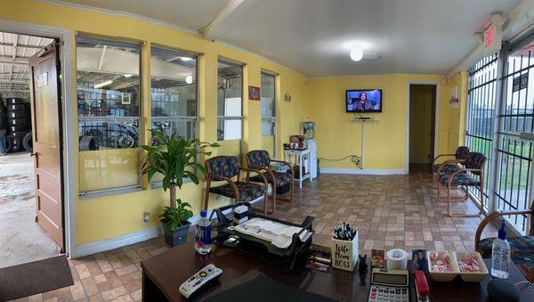 Clean waiting area with coffee station.