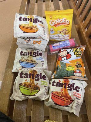 Tangle products: bulgogi Alfredo, creamy mushroom, chunky tomato, garlic oil, seaweed fishcake, and ginger coconut candy