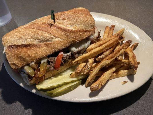 Carolina Cheesesteak: shaved sirloin, caramelized onion, bell pepper, bacon, bbq sauce, mozzarella, smoked gouda - AMAZING