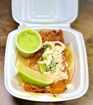 One 84 Taco to go - Cooked chorizo on a bed of cheese with avocado, queso fresco & chipotle sauce