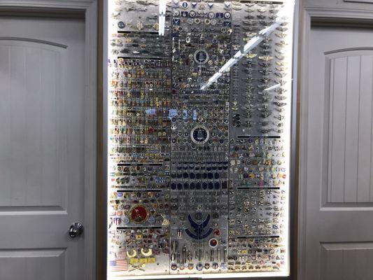 Wall of various lapel pins.