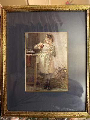 Little girl feeding her kitten milk