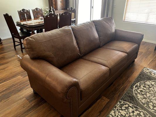 Brown leather couch that is perfect for our needs! I feel what I paid and the quality of the product was a fair price!