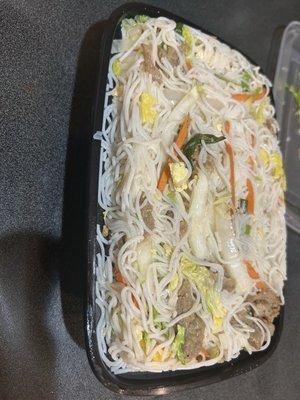 Beef chown mei fun. Packed to the rim and absolutely delish. Add soy sauce and good to go. Great go to sick/flu meal.