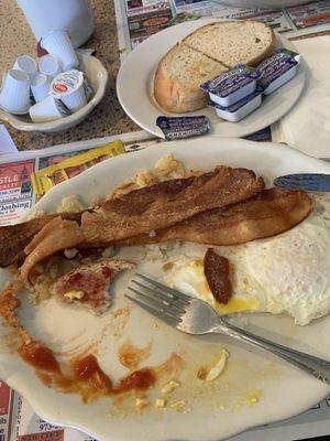 Two egg, bacon, home fries and toast which was