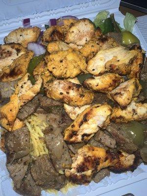Lamb and Chicken tikka over rice.