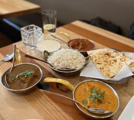 Chicken pakora, naan, chicken tikka masala, chicken vindaloo, lamb curry, gulab jamun and basmati rice.