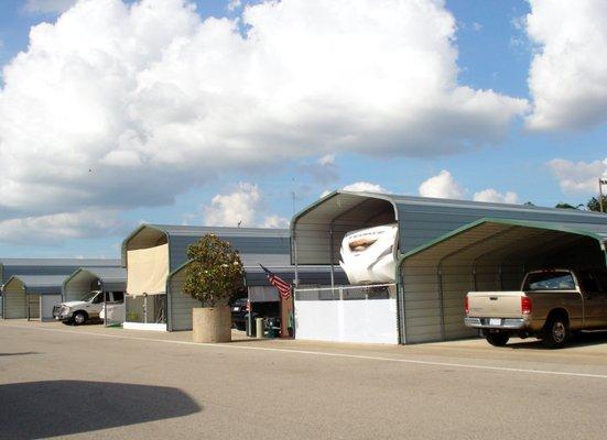 Covered sites with double carports and storerooms.