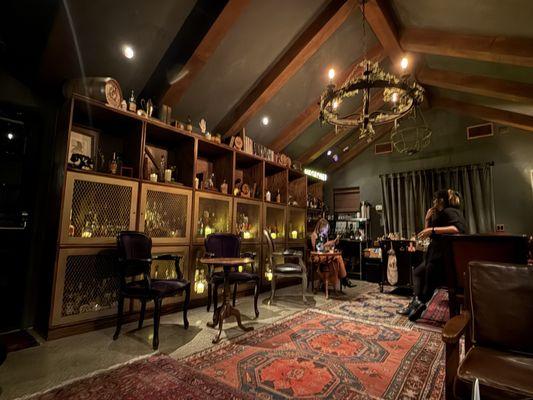 Interior, with the liquor cabinet wall