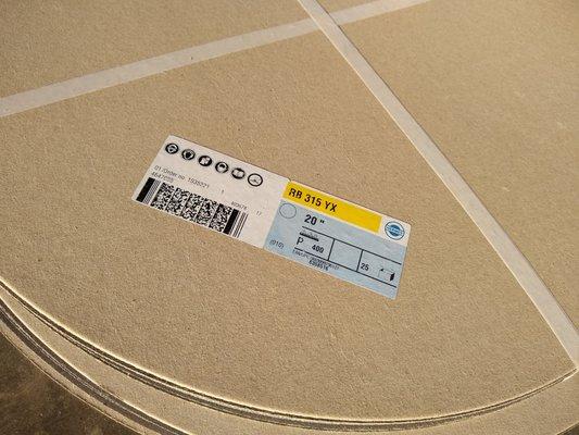 Custom-cut sandpaper and abrasives. These are 20" discs without holes.