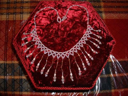 This wedding necklace was created by Terry Ann. Consisting of moonstones, pearls, and antique beads.