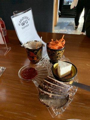 Rye bread, feta, carrot salad, pickled cabbage and hot sauce