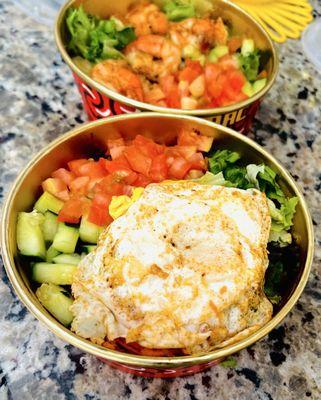 KBBQ Jerk Chicken Bowl and white rice, topped with carrots, cucumbers,, cabbage, lettuce, and egg.