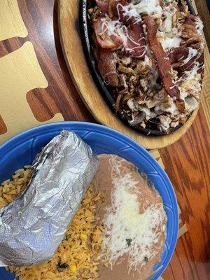 Can't remember the menu name but it was chicken, bacon, onions, bell peppers and cheese on a sizzling fajita platter, with beans and rice.