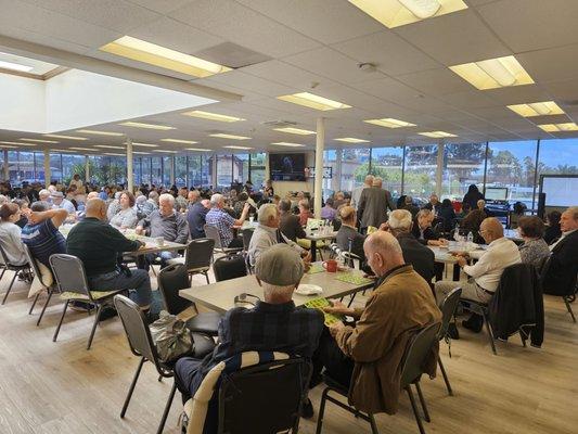 The participants are playing BINGO. They take it very seriously, I heard the prizes are amazing.