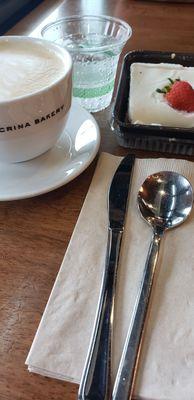 Latte with tres leches and fizzy water.