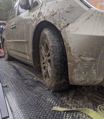 Stuck in the mud, snow or ditch? Grand Slam Towing will be there to safely put you back on solid ground!