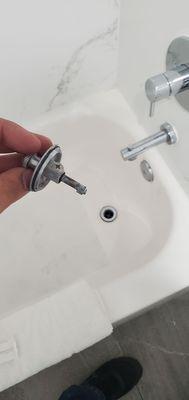 The bathtub stopper was completely broken.