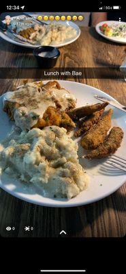 Country fried steak with mashed potatoes and okra.