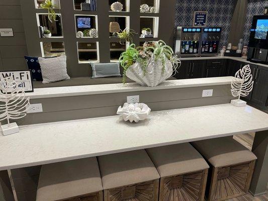 Leasing office with wine machine and Starbucks machine in the back.