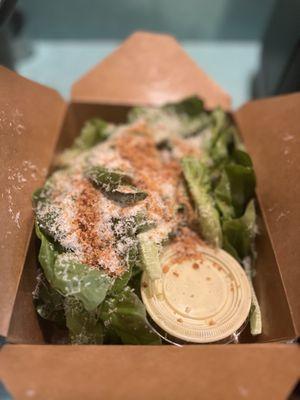 Day's Pizza has a Cesar salad and it comes loaded with toasted breadcrumbs and grated grana panado