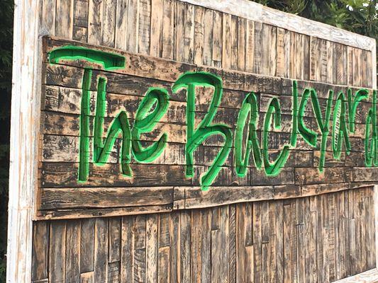 Follow the sign to the backyard