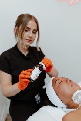 Shelby doing an acne peel.