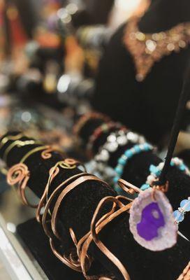 Hand hammered copper jewelry and precious jeweled creations by local artisans.