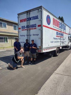 This is a picture of my son, happily kneeling after a job well done by the workers at Move Central.