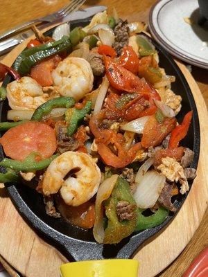 Steak, chicken and shrimp fajitas! Delicious