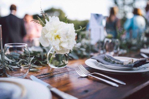 Outdoor wedding greens and whites floral tablescape