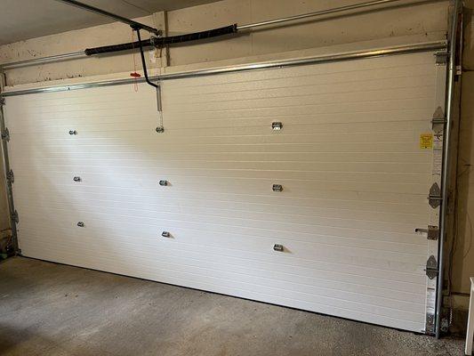 Great job by Overhead Door Company.  Note the high performance cylindrical torsion spring, near the top.