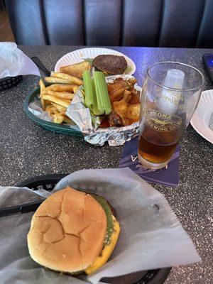 Cheese burgers, wing basket with fries and beer.