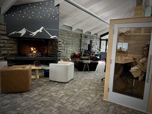 Step into a private phone booth for privacy or curl up next to the fire if you're tired of working at your desk.