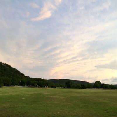 Looking South from the sports court towards outdoor area, pool, volleyball court and Tree Chapel.