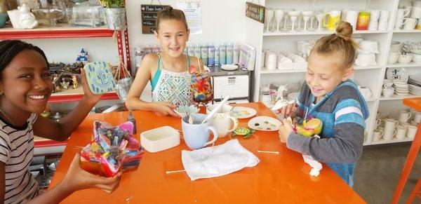 Having fun making candles and painting pottery!!
