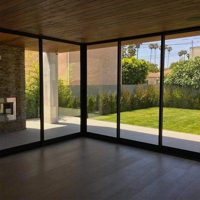 Corner stacking multi-slide aluminum door with protective film for privacy and sun protection