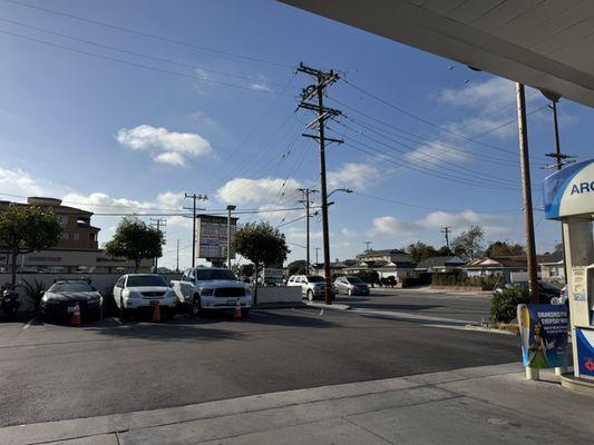 This gas station is next door to a strip mall with an Indian grocery store.
