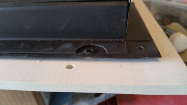 Damper crudely cut from another product, then "attached" (see the tiny screw holes, that failed)