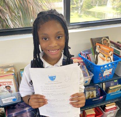 One of our Elementary students sharing her excellent work with us.