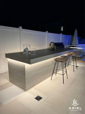 A stylish and functional outdoor kitchen designed for cooking, entertaining, and enjoying the outdoors.