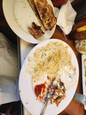 Egg white Corned Beef and Swiss omelette, hash browns, and cinnamon raisin toast topped with melted butter
