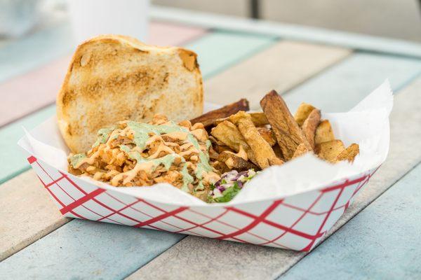 Smoked Spicy BBQ Chicken Sandwich topped with our Signature and Cilantro Sauce.