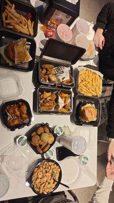 Burgers, various wings, rice bowl, fries, and fried pickles.