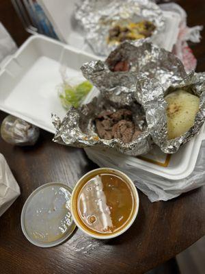 Parrillada for one.   Fajitas and sausage  served with corn tortillas, charro beans chips and salsa.